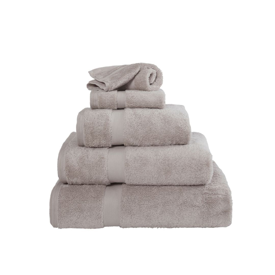 Stack of silver towels on a white background
