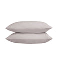 Two light gray pillows on a white background
