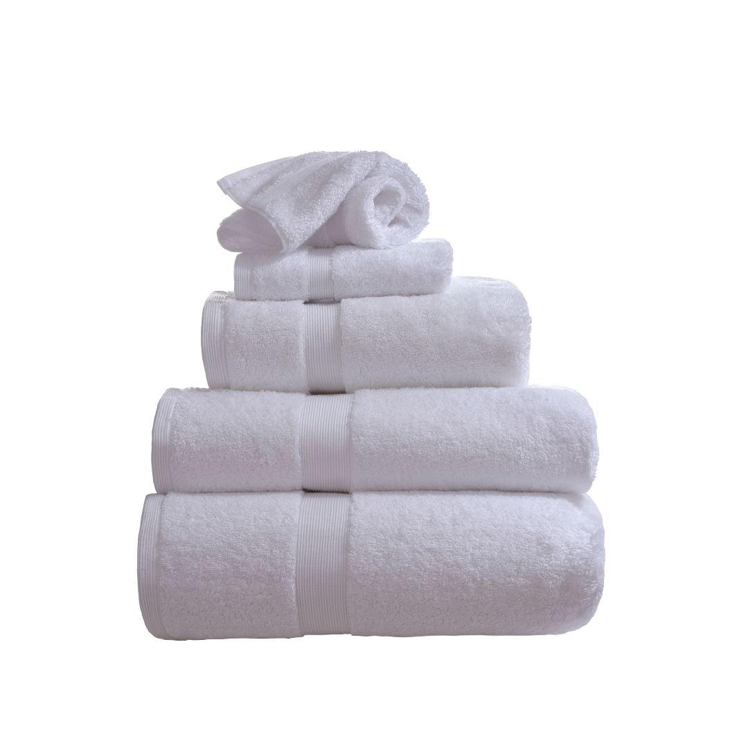 Stack of white towels on a white background
